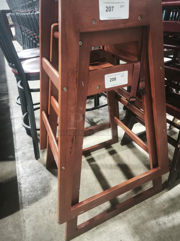 Red wood restaurant bar-height high chair with a built-in step. Features label "208 QTY" for auction identification.