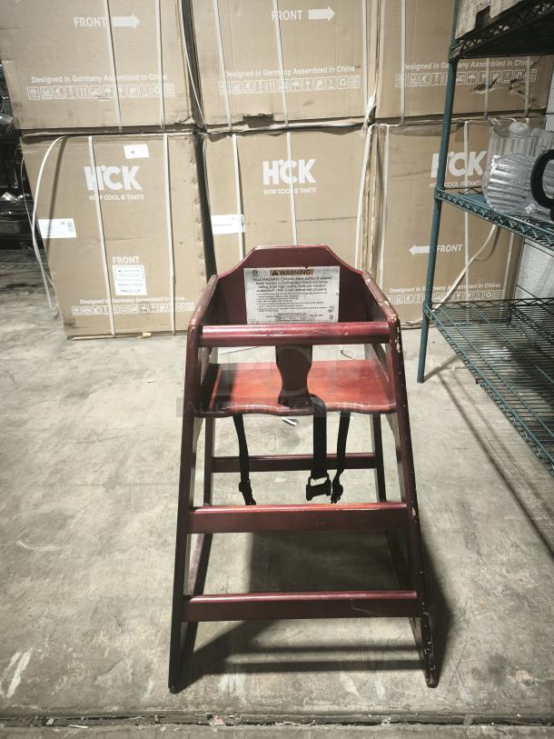 CHH-103 29 3/4" stackable wood high chair with waist strap; visible wear; warning label on backrest.