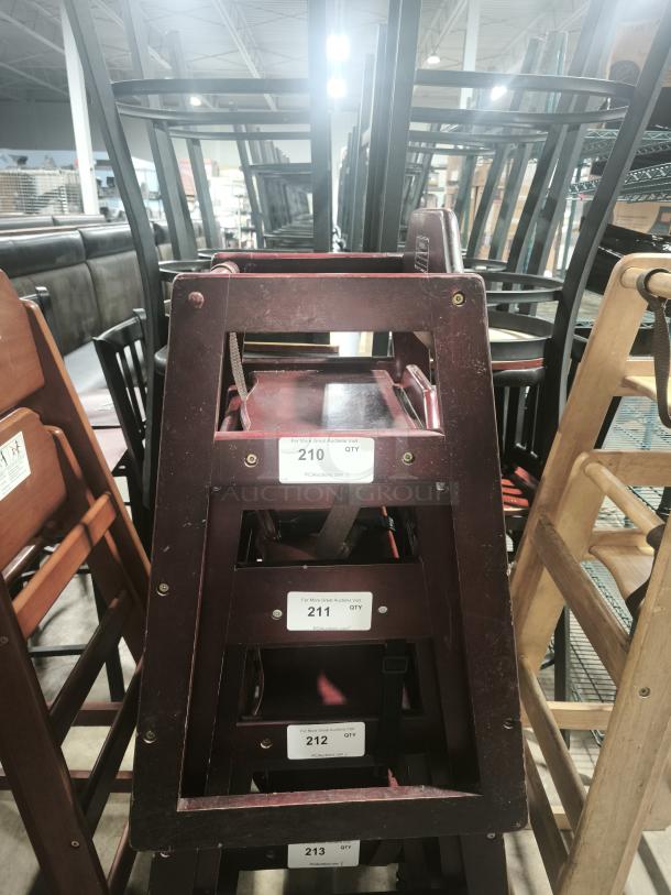 CHH-103 high chair, 29 3/4", stackable wood, with waist strap. Visible auction tags numbered 210-213.