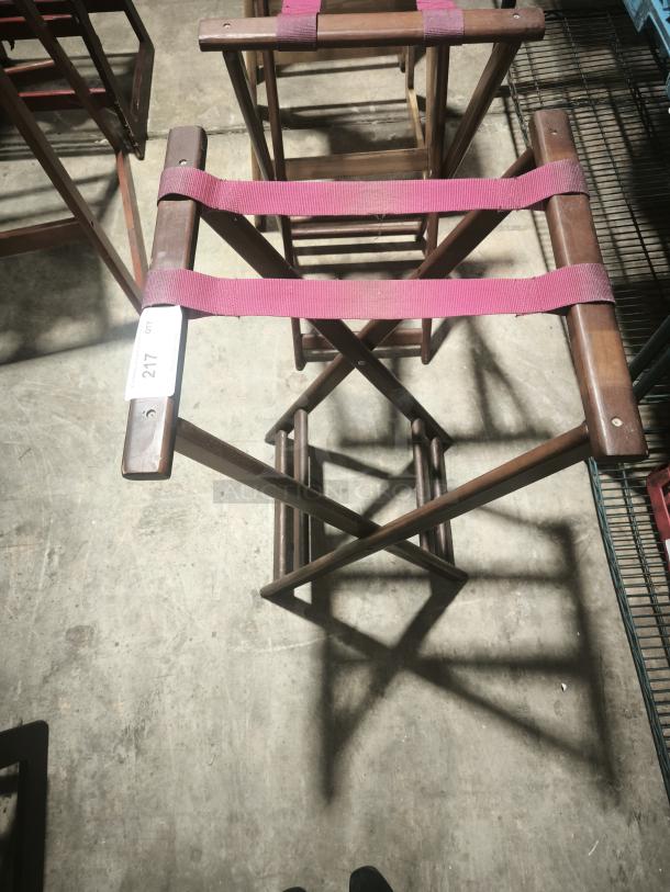 Folding wooden tray stand, 32-1/4" high, with red straps and a visible label numbered 217. Good condition.