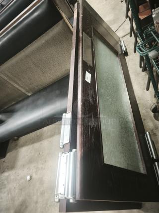 Solid wood double door with glass sliding panel and grill design, modern interior style, excellent condition, visible hinges.