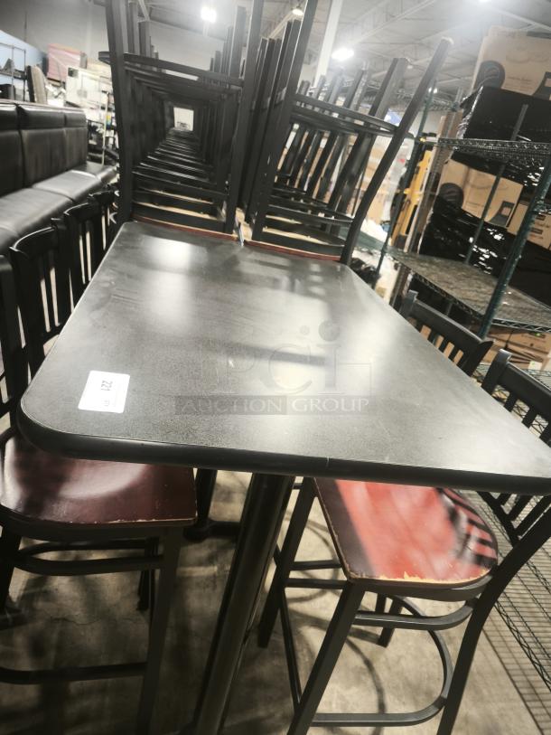 Premier Café height tables with black surface and metal legs, stacked for display. Visible minor wear on seats. Tag marked "221".