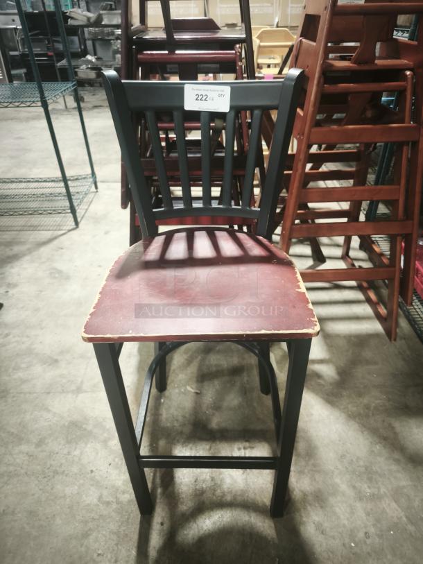 Premier café height chair with a maroon seat and black slatted back, visible wear on edges, labeled "222."