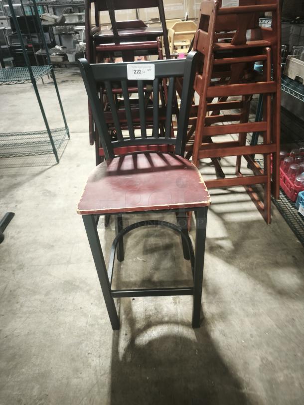 Premier café height chair with a red distressed seat and black frame. Condition: used. Tag indicates quantity 222.