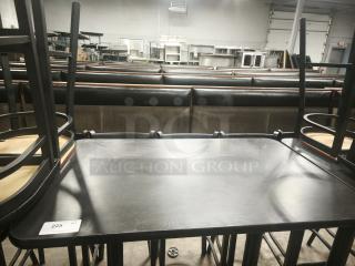 Premier Café Height Table, black surface, metal base, good condition, item tag 225, ideal for restaurant settings.