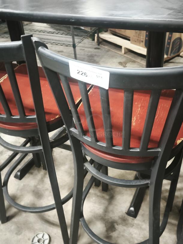 Black metal dining chair with a mahogany wood seat and school house back design. Visible tag indicates quantity.