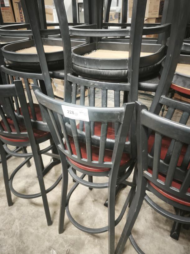 Black School House Back Metal Dining Chairs with mahogany wood seats, stacked in storage; tag indicates quantity "228."