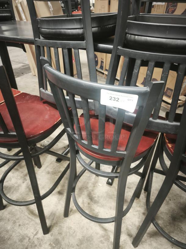 Metal dining chair with mahogany wood seat, black metal frame, and slatted back. Visible tag indicates auction quantity.