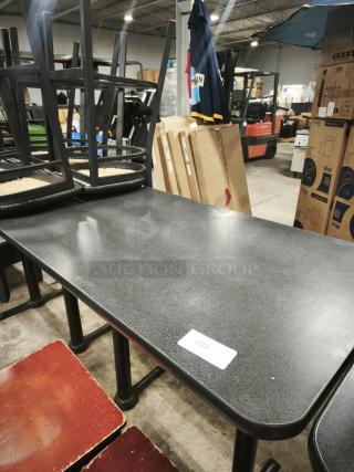 Premier Café Height Table with black laminate top and sturdy base. Minor wear visible. Label marked "233." Ideal for dining use.