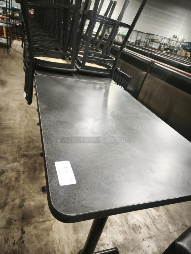 Premier Café height table with sturdy black surface and metal frame. Minimal wear. Label shows "235 QT."