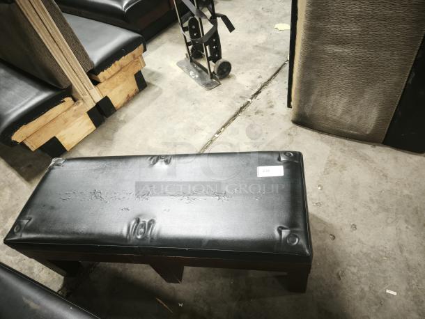 RACK Tuscany Storage Bench with black leather upholstery, high-density foam, visible wear on the surface, labeled "238."