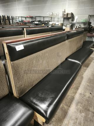 Mid-channeled style restaurant booth with headroll, featuring a black leather seat and patterned backrest. Visible tag number 241.