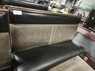 Mid-channeled restaurant booth with headroll, black leather seat, textured backrest, tag "243 GTY", good condition.