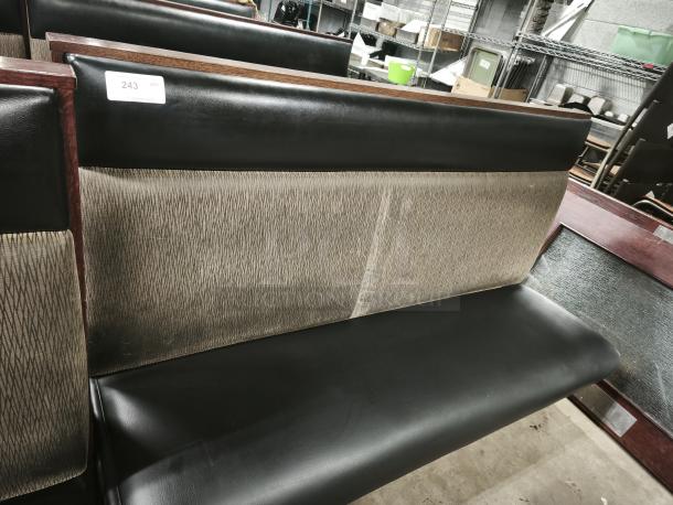 Mid-Channeled style restaurant booth with headroll, black and patterned upholstery, wood frame, auction tag showing "243".