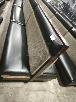 Double mid-channeled restaurant booth with headroll, featuring black and beige upholstery, wood frame, and label marked "244."