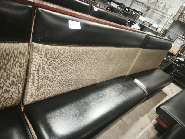 Double mid-channeled restaurant booth with headroll, featuring black seats and patterned backrest. Slight wear visible. Label: "245".