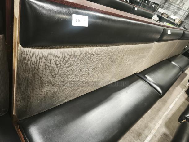 Single mid-channeled style restaurant booth with headroll, black and tan upholstery, labeled with "246", gently used condition.