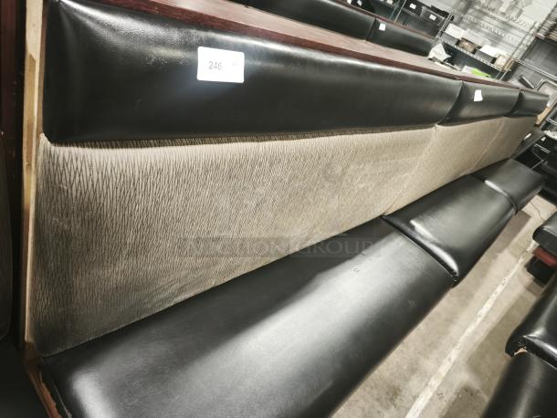 Single mid-channeled restaurant booth with headroll, black and textured beige upholstery, good condition, tagged "246."