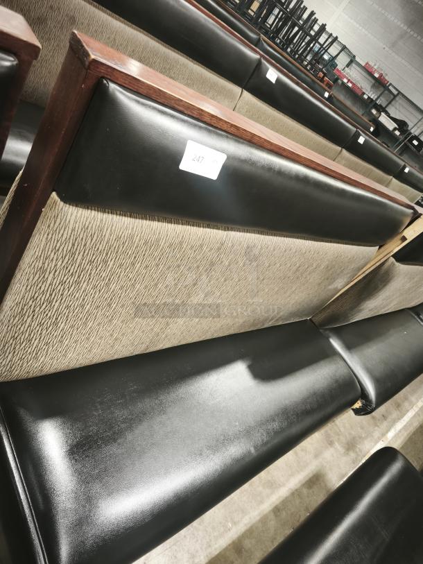 Double mid-channeled restaurant booth with headroll, good condition. Black upholstery, wood trim. Label: "247."