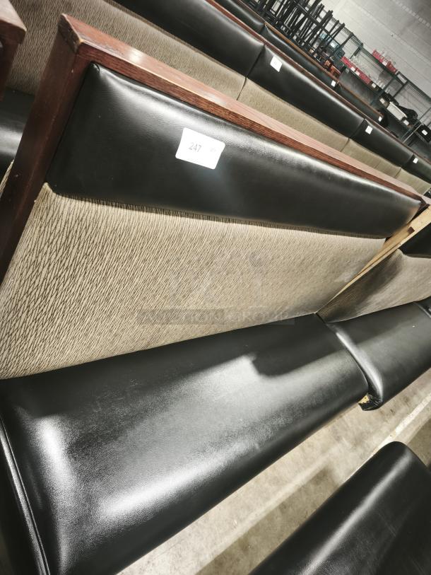 Double mid-channeled restaurant booth with headroll, black leather, wood trim, excellent condition, lot number 247.