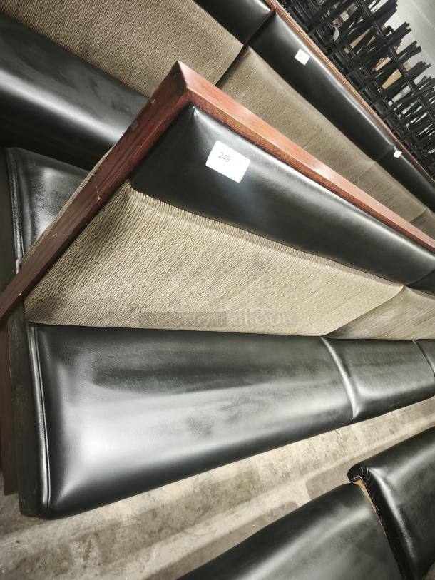 Double mid-channeled restaurant booth with headroll, excellent condition. Features wood framing and mixed-material upholstery.