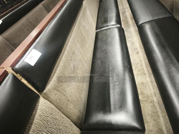 Double mid-channeled restaurant booth with headroll, features black upholstery and backrest, in good condition, label marked "250".