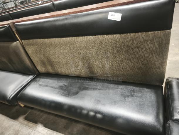 Single mid-channeled style restaurant booth with headroll, black faux leather and patterned fabric, shows slight wear, tag marked "260 QTY".