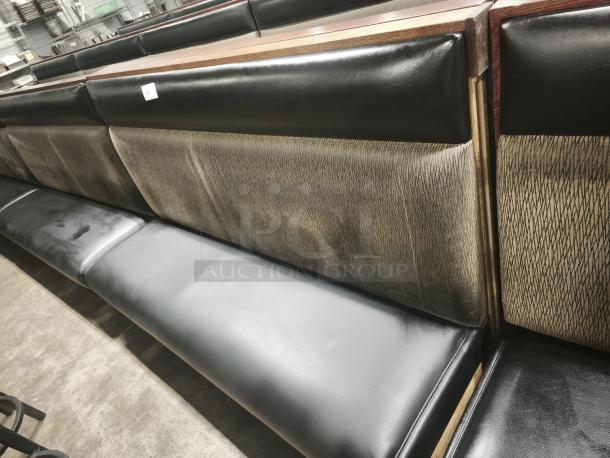 Single mid-channeled style restaurant booth with headroll, featuring textured fabric backrest and black leather seat. Good condition.