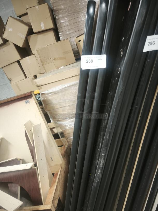 Rectangular table panels, designed for fixed booth seating, stacked. Marked “268 QTY.” Seen with wooden and cardboard parts.