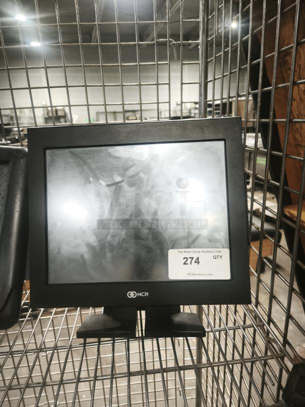 NCR POS monitor and terminal with cables. Features NCR branding and clear display. Used condition. Auction tag number 274.