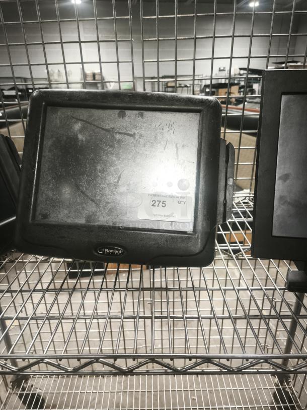 Radiant Systems POS display monitor on metal shelf, used condition, visible scratch marks, logo on front bezel.