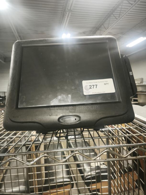 Radiant Systems POS display monitor, black frame, used condition, auction lot number 277 visible on the screen.