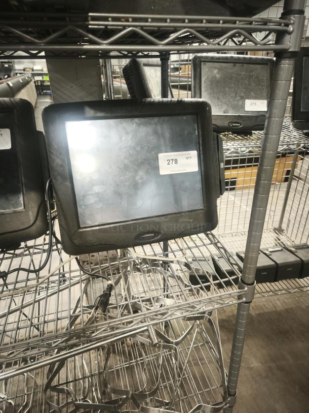 Radiant Systems POS display monitor, black, used condition, visible power cords, labeled with auction tag number 278.