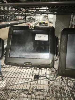 Radiant Systems POS display monitor on shelving, showing signs of wear. Label indicates auction lot number 279.