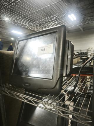 Radiant Systems POS display monitor on metal shelf; black frame, visible screen; label reads "283 QTY PCAuctions.com."