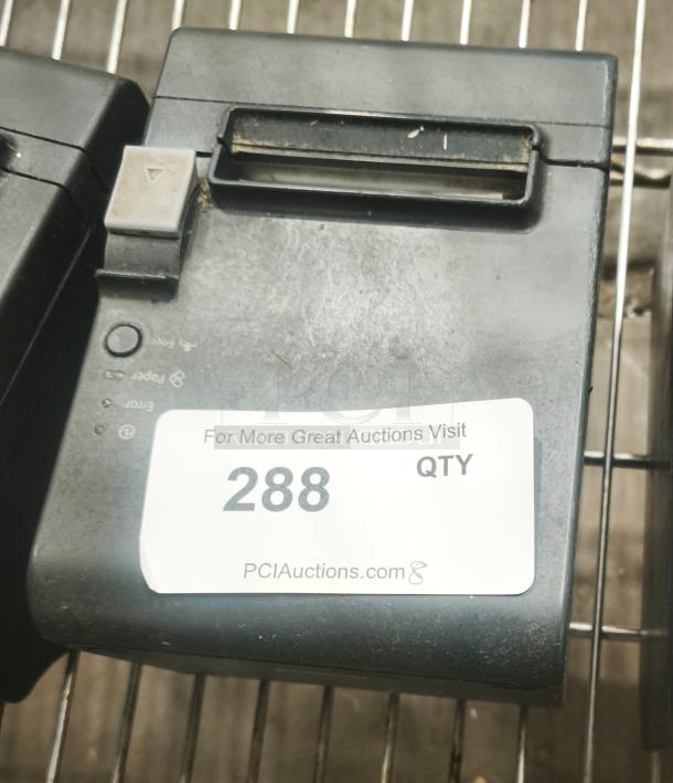 Epson thermal receipt printer for POS, used condition, labeled "288" from PCIAuctions.com, on metal shelf.