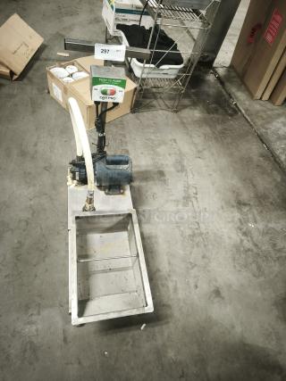 Dar Pro Solutions Grease Caddy on casters, with pump control panel. Visible wear, sturdy construction, efficient handling.