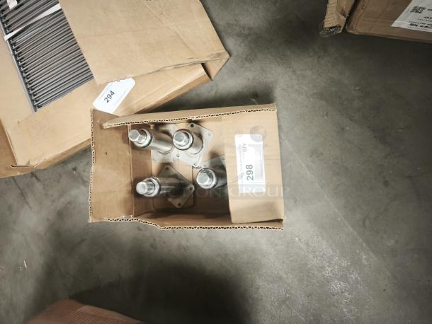 Brand new stainless steel leg assembly in box, with four legs. Box labeled "298 QTY," indicating item condition and quantity.
