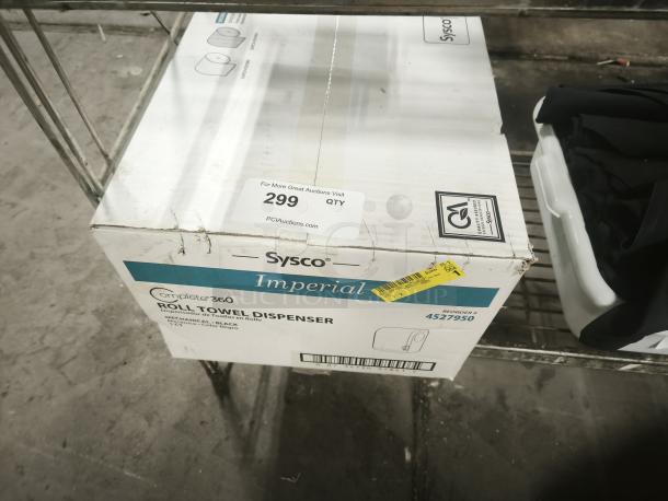 Brand new Sysco Imperial Complete 360 Roll Towel Dispenser in original packaging. Box labeled with "Reorder #4527950" and auction tag.