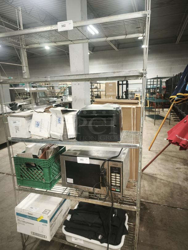 5-tier metal shelving unit with S-hooks, holding various warehouse items. Visible tags show item numbers 302 and 303.