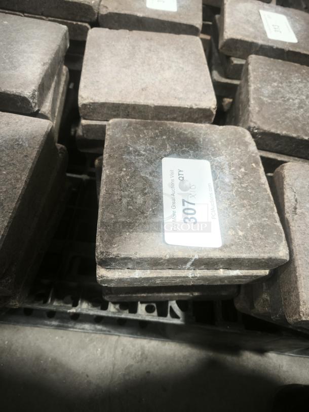 NSF certified volcanic granite slabs for cooking, stack of rectangular stones, each with label showing quantity.