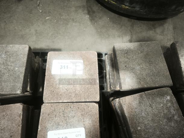 NSF certified volcanic granite slabs for cooking, rugged surface, labeled "311 QTY," suitable for food preparation.