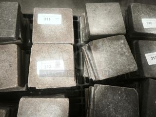 NSF Certified volcanic granite cooking slabs, excellent condition, labeled with auction lot numbers.