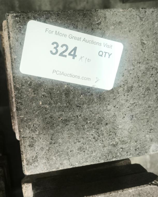 NSF certified volcanic granite slab for cooking, auction tag reading "324 QTY," by PCIAuctions.com.