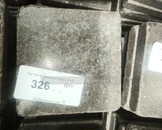 NSF certified volcanic granite slab for cooking, square shape, earthy tones, label with auction details.