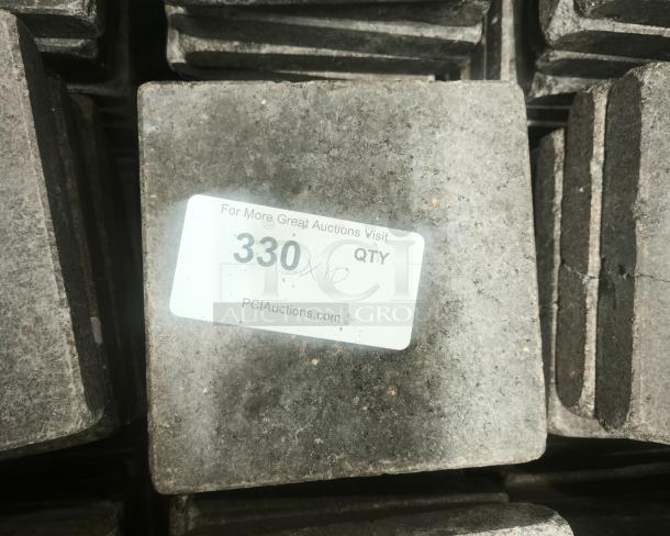 NSF Certified volcanic granite stone for cooking, square shape, slightly rough texture, PCI Auctions label on top.