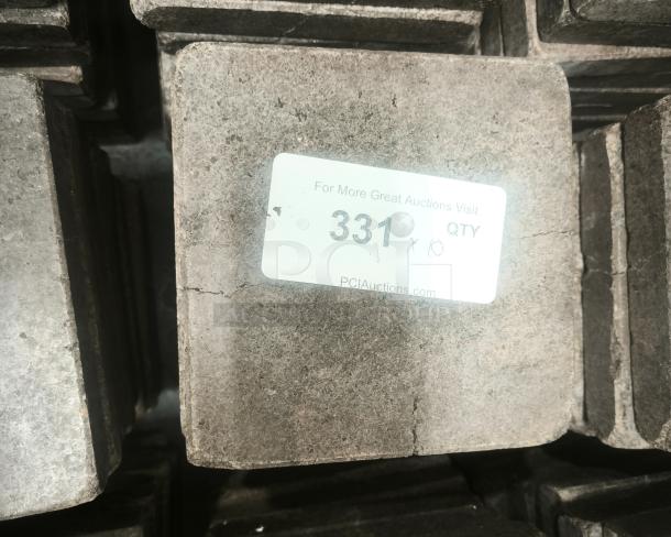 NSF certified volcanic granite cooking slab, square, gray, labeled "PCI Auctions," in excellent condition.