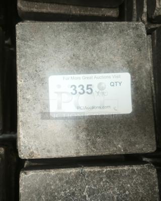 NSF certified volcanic granite slab for cooking, used, dark surface, label with text "335 x 10" and PCI Auctions website.