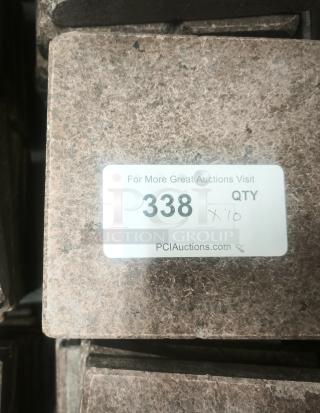 Volcanic granite slab for cooking, NSF certified, labeled with auction lot number 338 and quantity 10 from PCIAuctions.com.