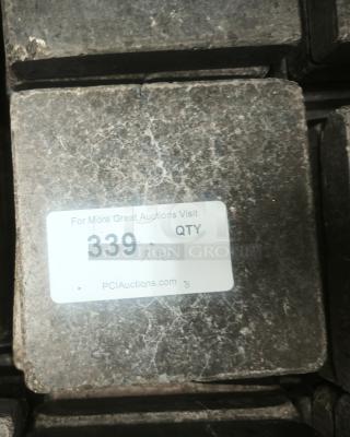 NSF certified volcanic granite slab for cooking, shows quantity label "339 QTY 10" from PCIAuctions.com.